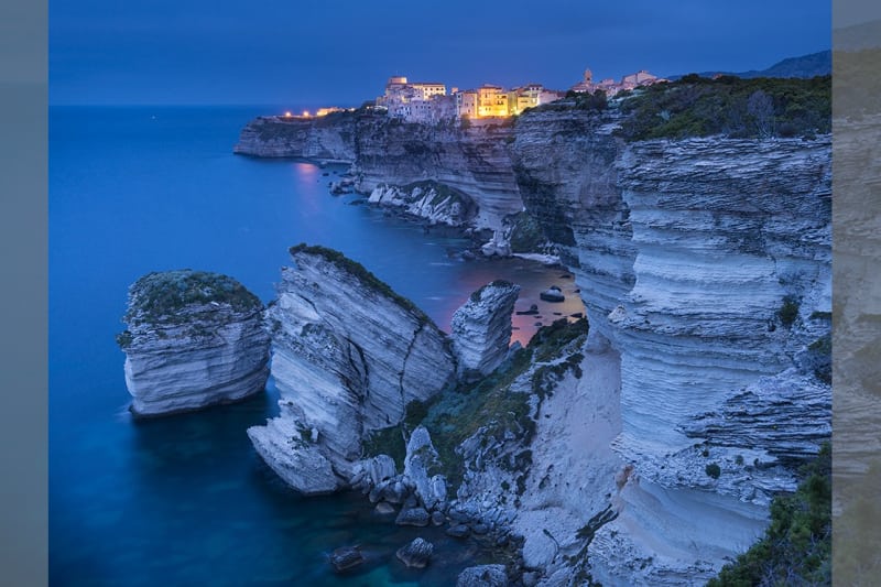 Bridebook.co.uk- seaside town on a cliff at night