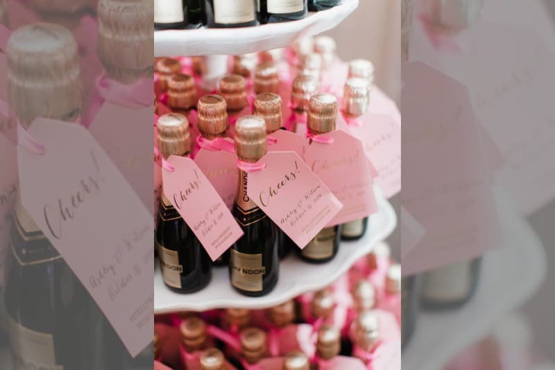 bridebook.co.uk mini pink champagne bottles as wedding favours