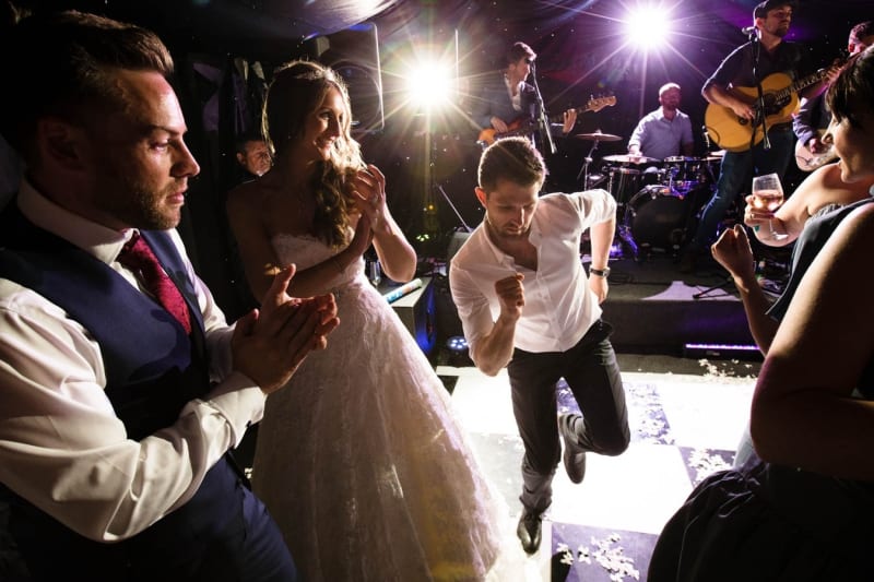Bridebook.co.uk - bride and groom dancing with guests