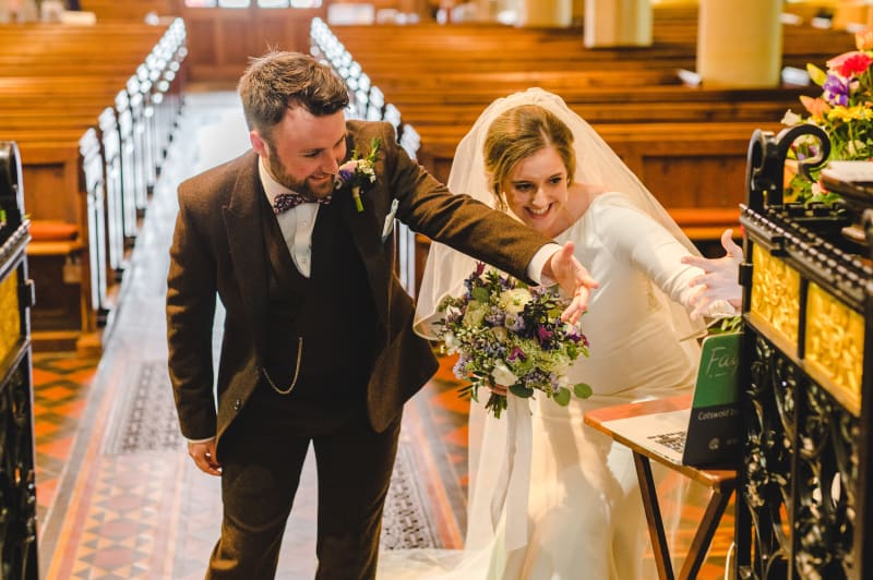 Faye and Adam Hughes in the church getting married