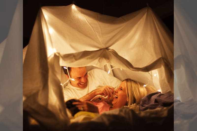 couple in tent with fairylights