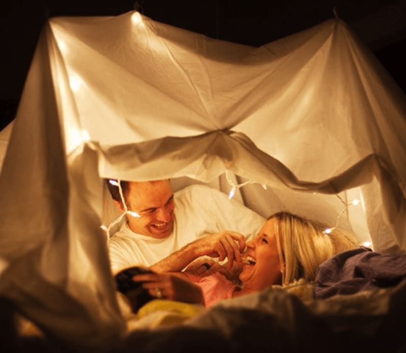 couple in tent with fairylights