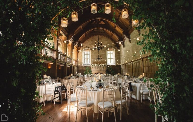 Beautiful barn wedding venue with tables and chairs set up