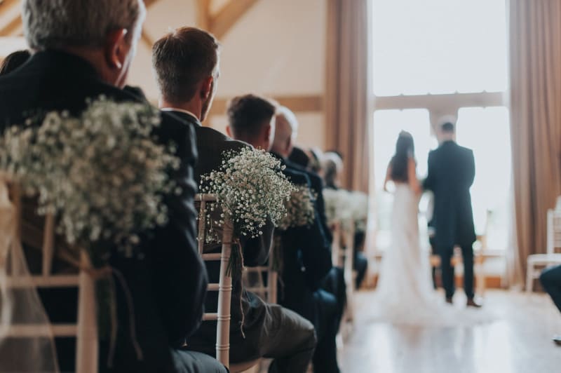 Faye and Adam Hughes in the church getting married