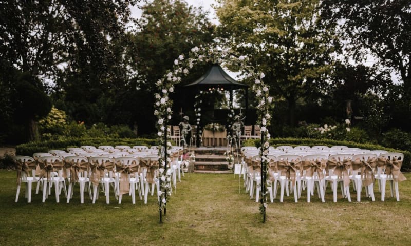 The garden gazebo is set for the civil ceremony outside.