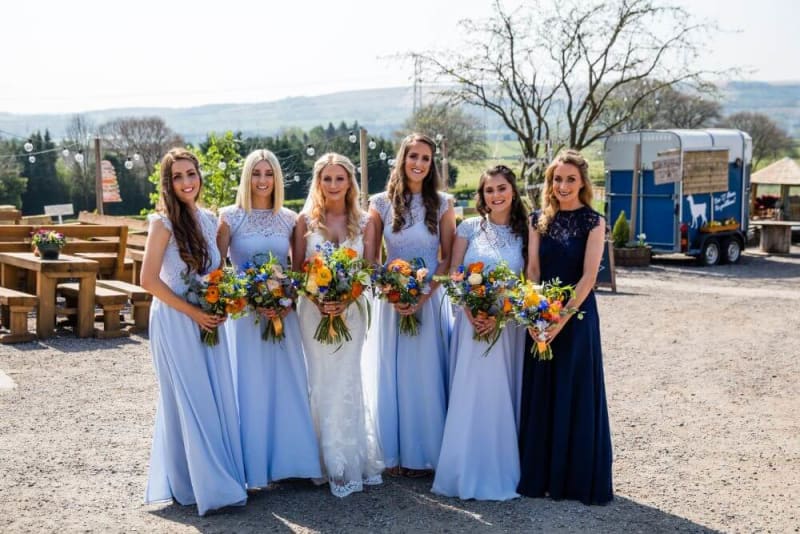 The bride posing with her bridesmaids.