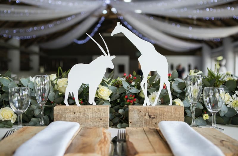 Woodland animals on seats at wedding with woodland animal wedding theme