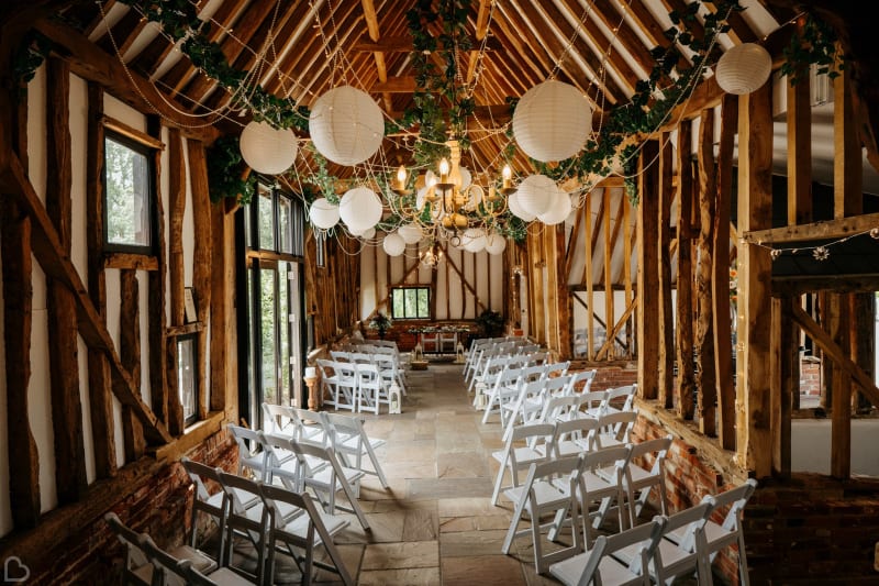 Beautifully decorated barn, ready for an intimate wedding ceremony at High House Weddings. 