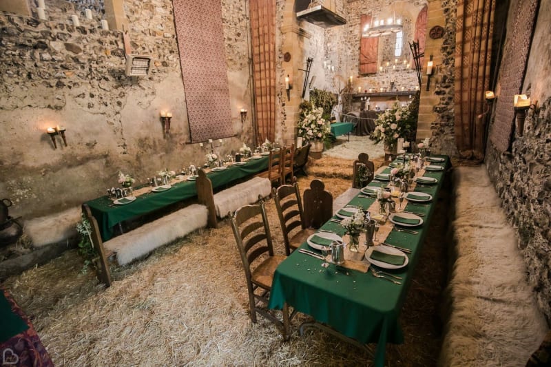 Two tables set up for an intimate wedding dinner in The Lost Village of Dode