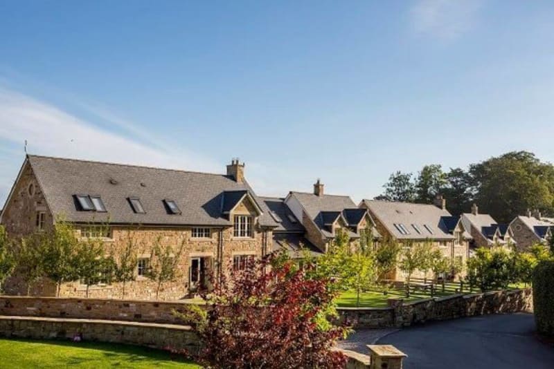 Several cottages next to each other.