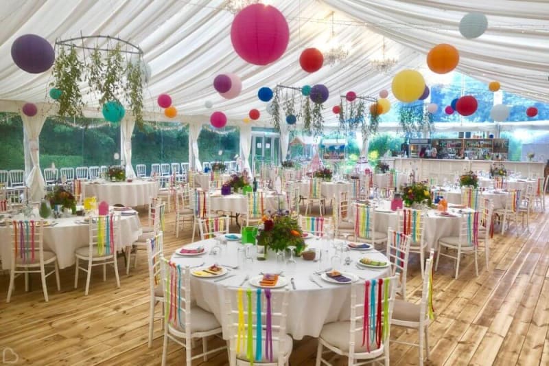 The interior of the big tent decorated in colorful colors.