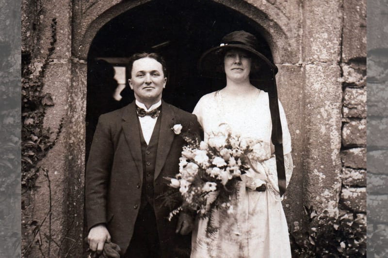 A black and white picture of a newlywed couple.