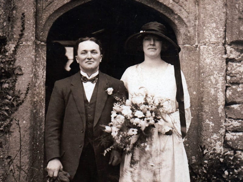 A black and white picture of a newlywed couple.