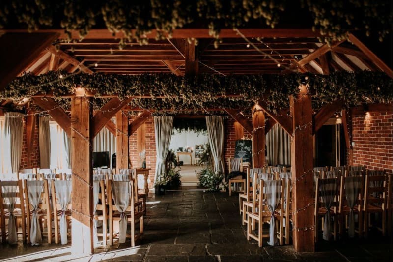 The interior of the venue shows brick walls with an oak ceiling.