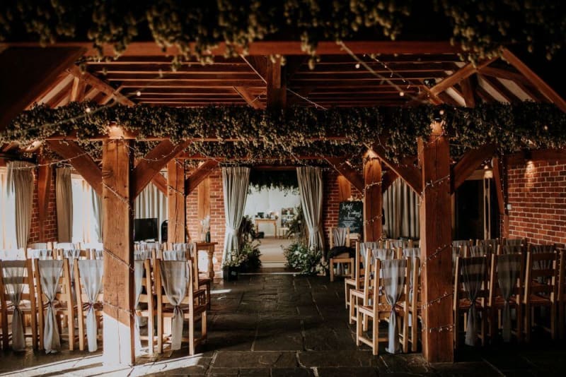 The interior of the venue shows brick walls with an oak ceiling.