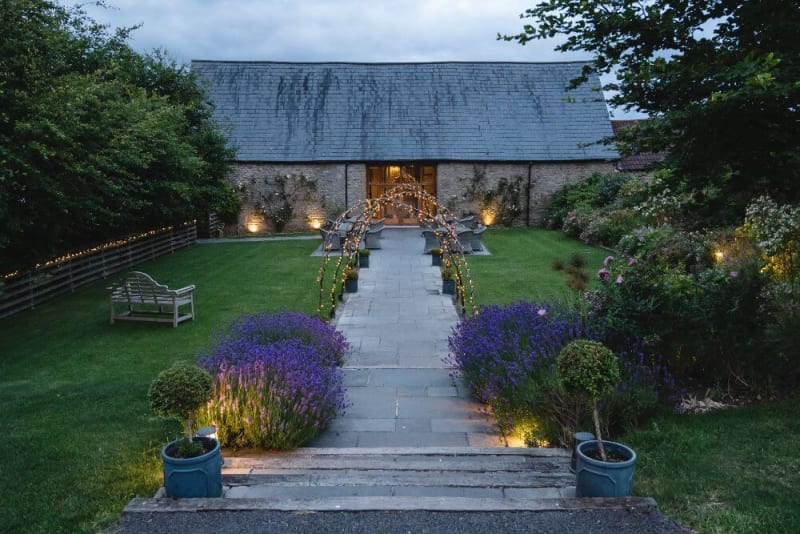 The outside area with a path that leads to the barn.