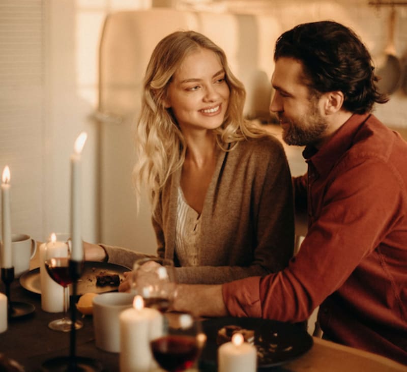 couple having dinner with candles