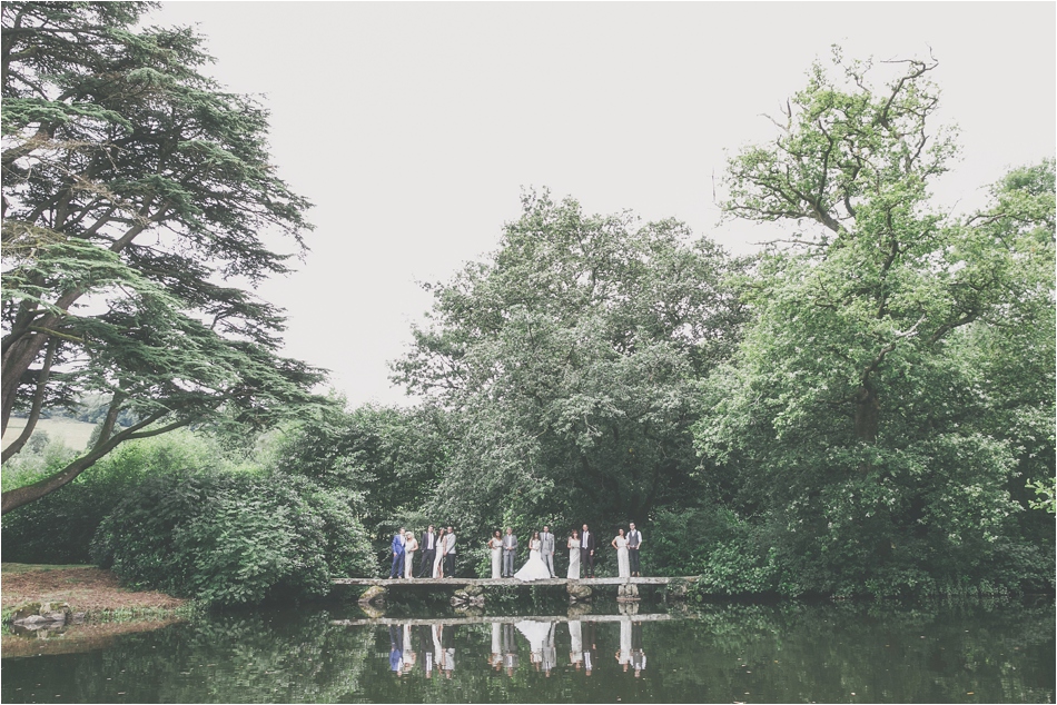 Bridebook.co.uk Wedding party across lake