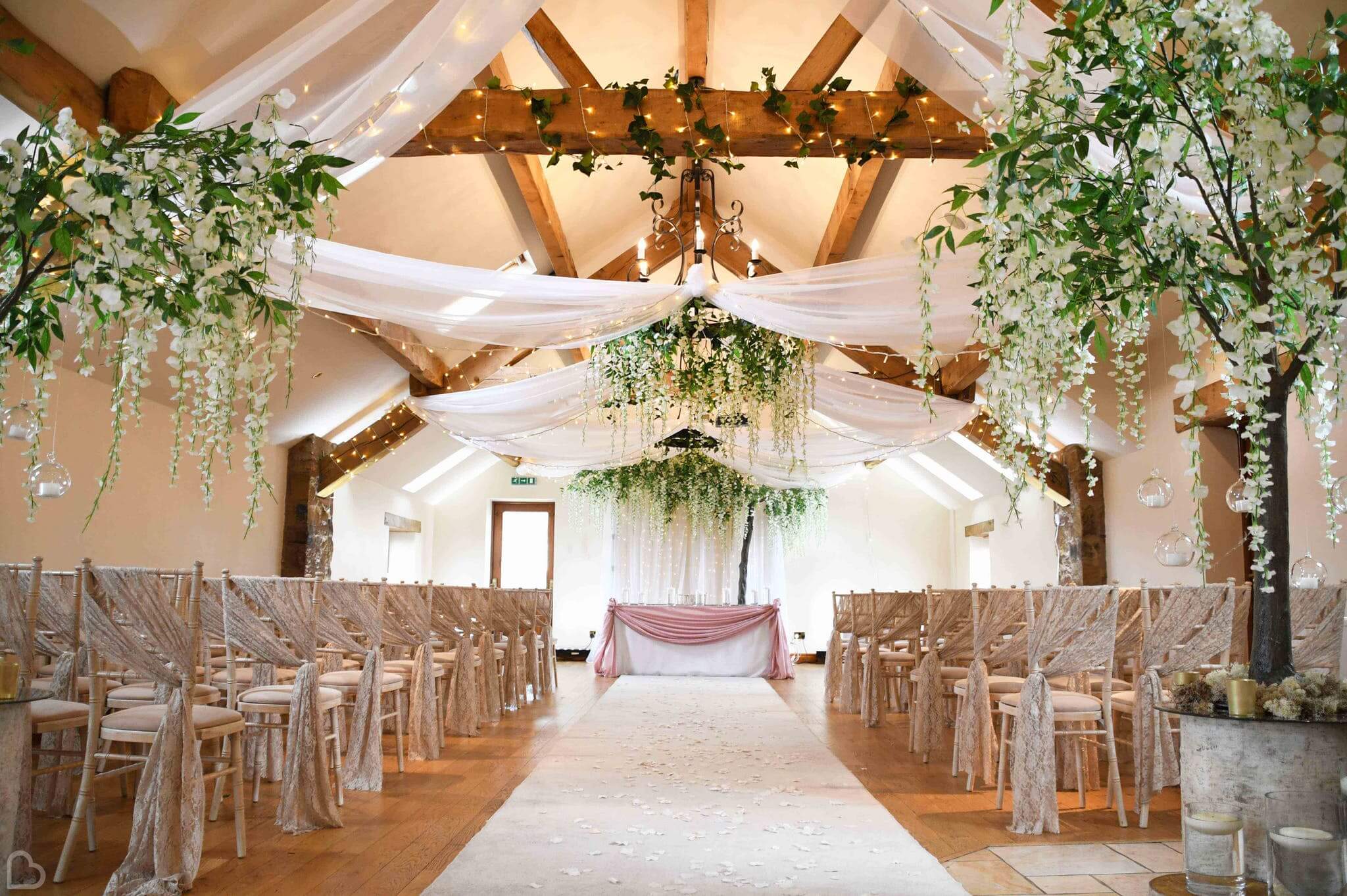 Beautifully decorated with flowers all over, Beeston Manor wedding venue is set up for a wedding ceremony.