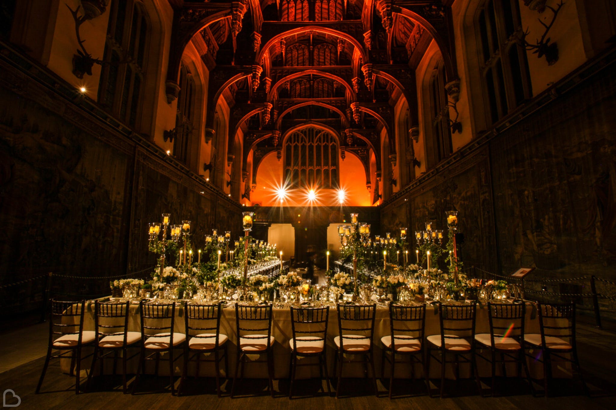 the opulent hampton court house, darkly lit for a wedding