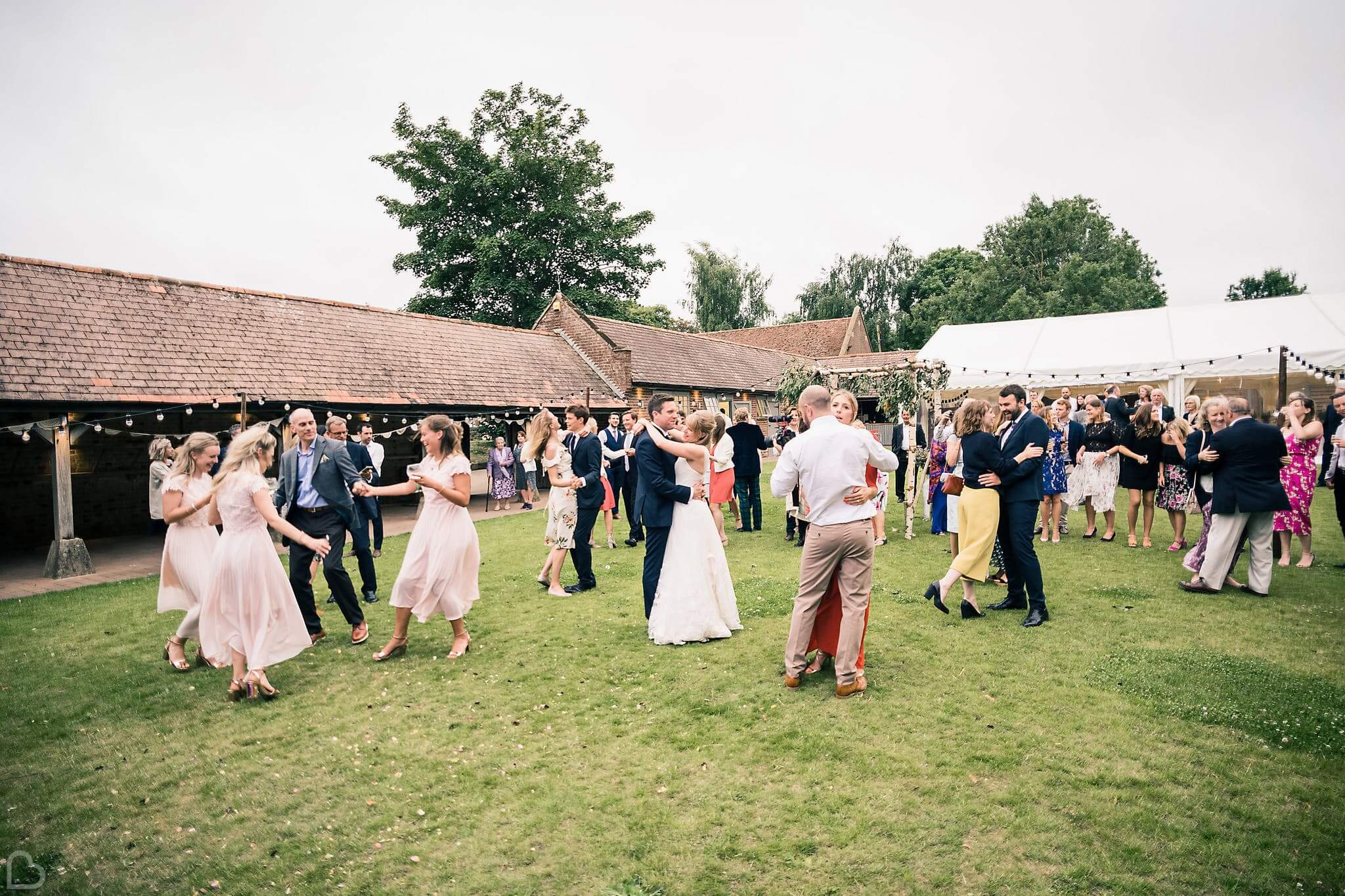 wedding guests dance at the night yard in kent