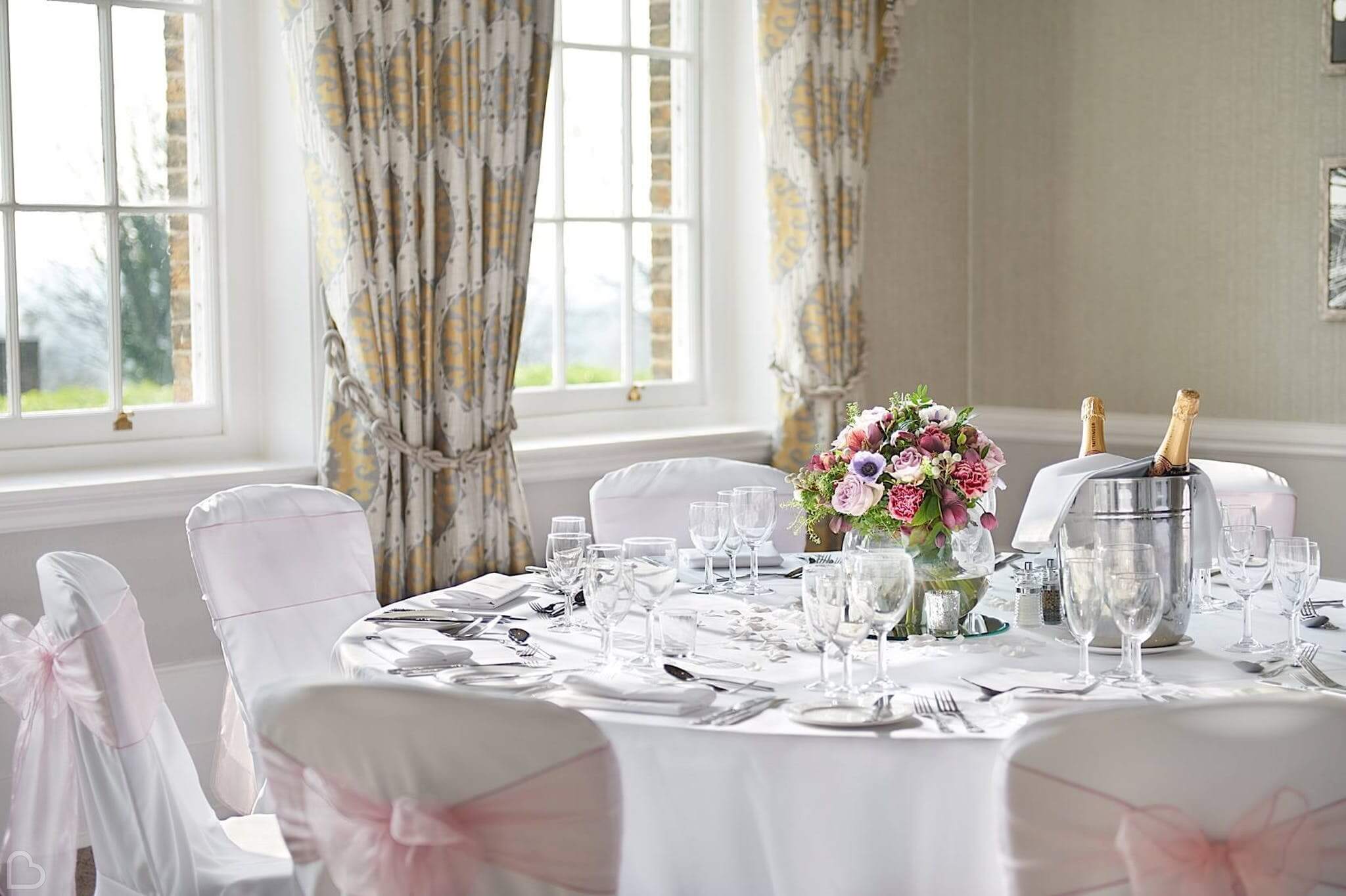 the richmond hill hotel a table is set at the corner with light coming in from the window