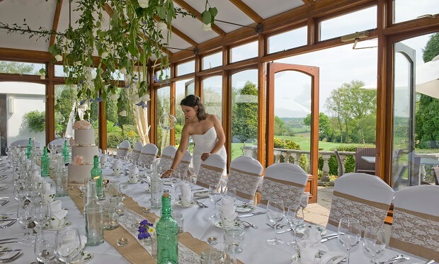 women setting up the table at kingswood golf and country club