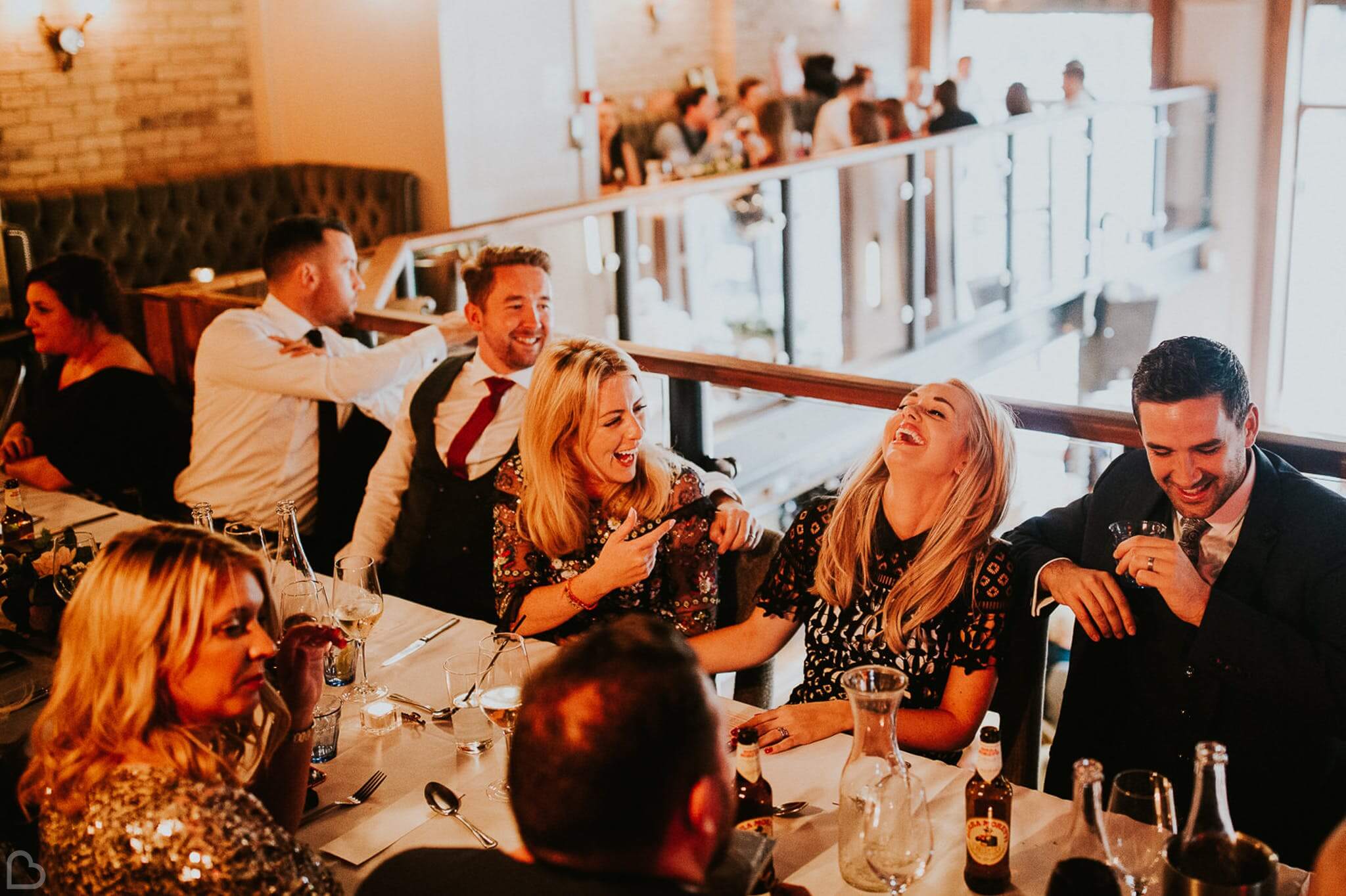 guests laugh and drink at st. bart's brewery in london