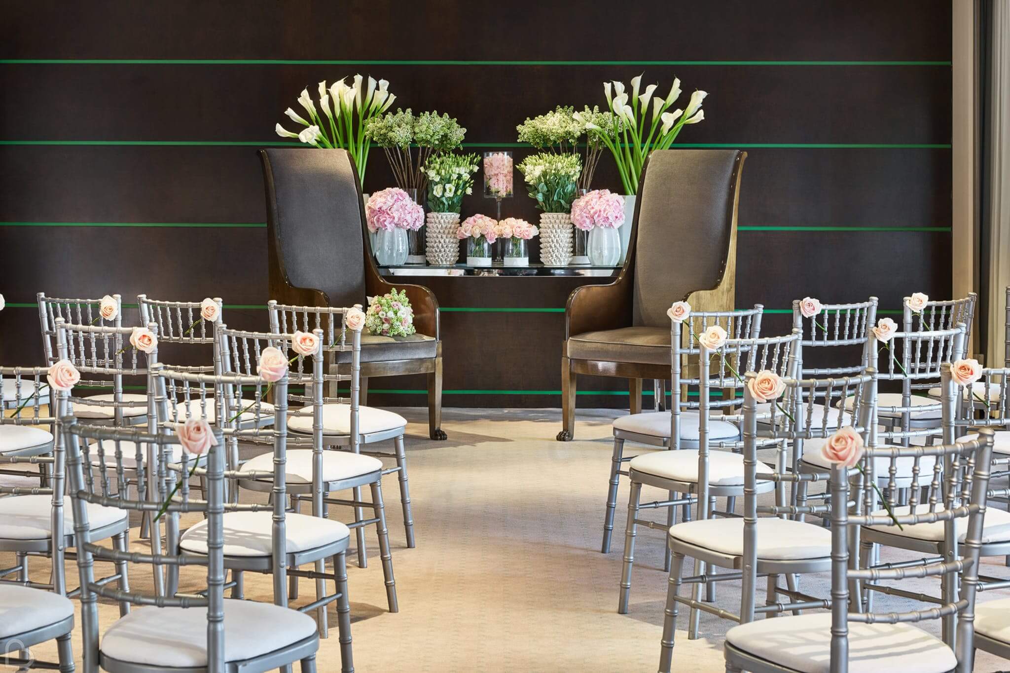 one aldwych hotel with chairs and flowers set for a wedding ceremony