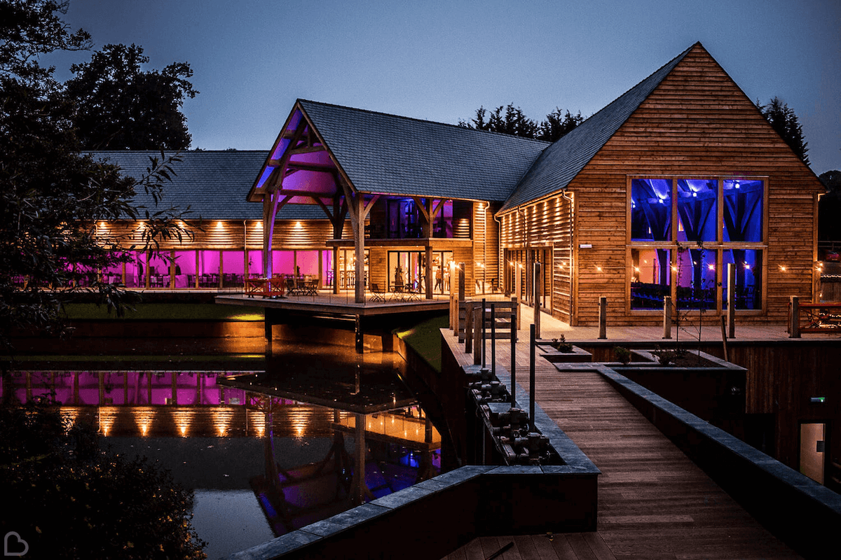 The Mill Barns lit up with purple and blue lights for a night party.