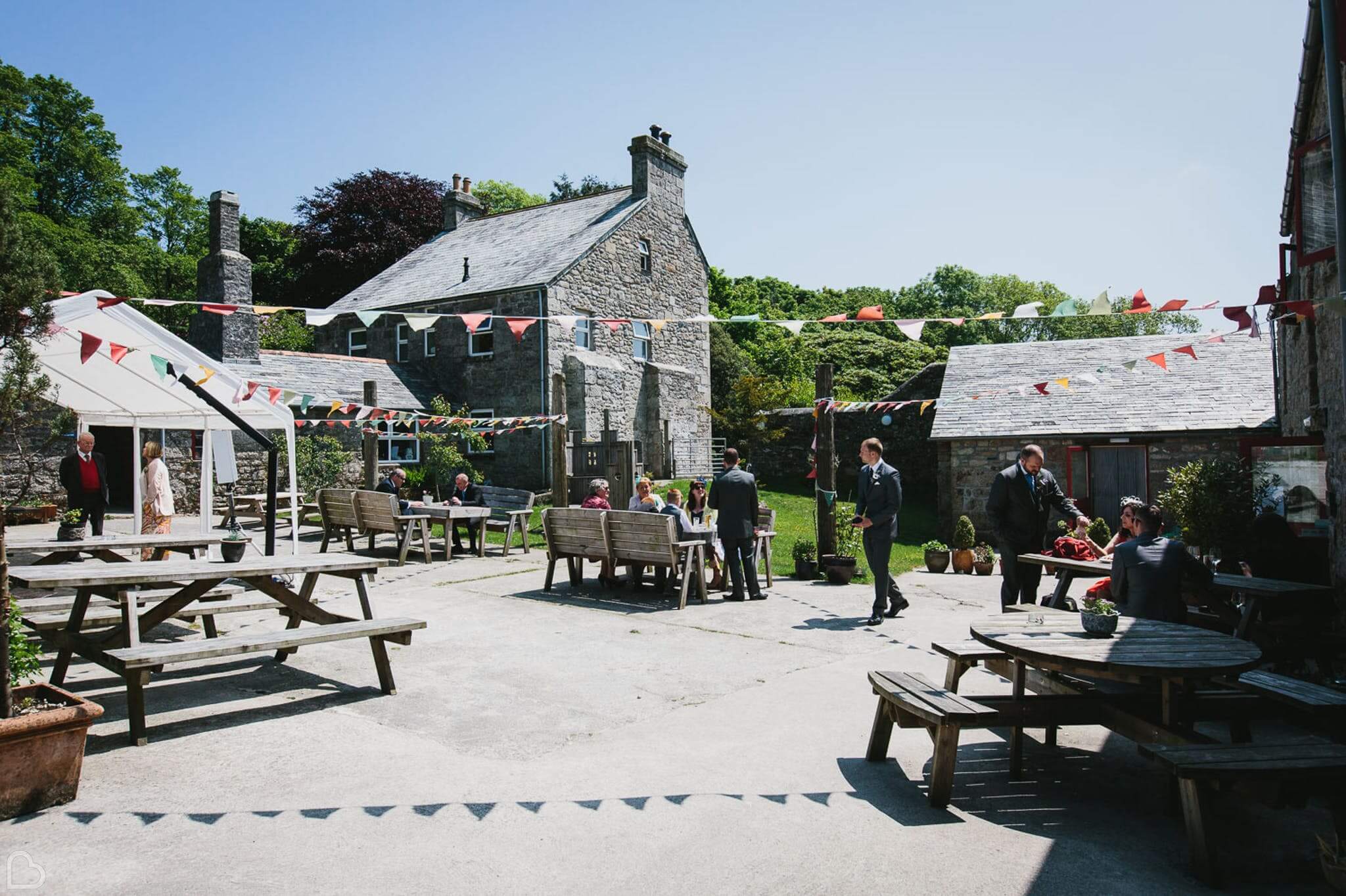 Guests mingle outside in Knightor Winery in Cornwall