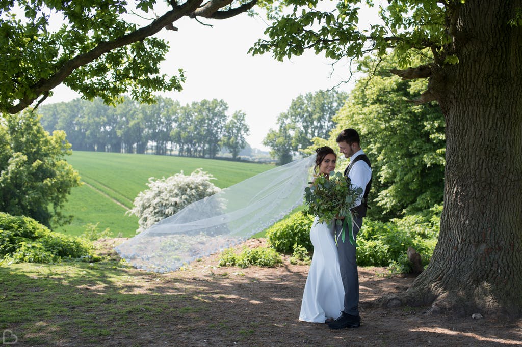 Newlyweds pose.