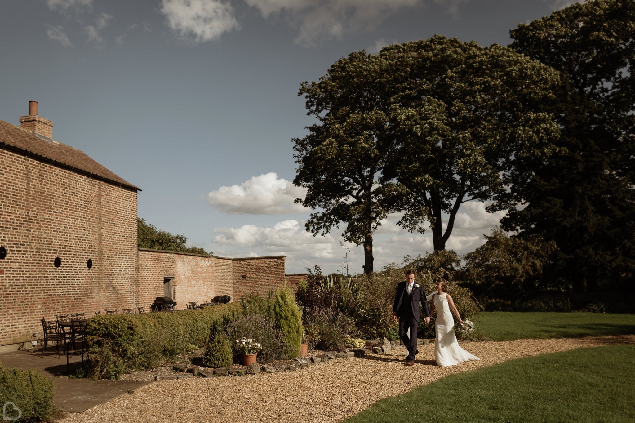 Married couple walking outside Hornington Manor.