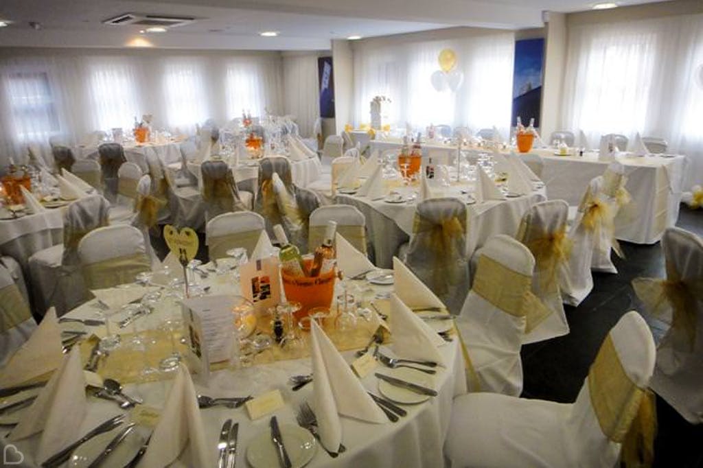 wedding lunch with tones of yellow and orange the selhurst park stadium.