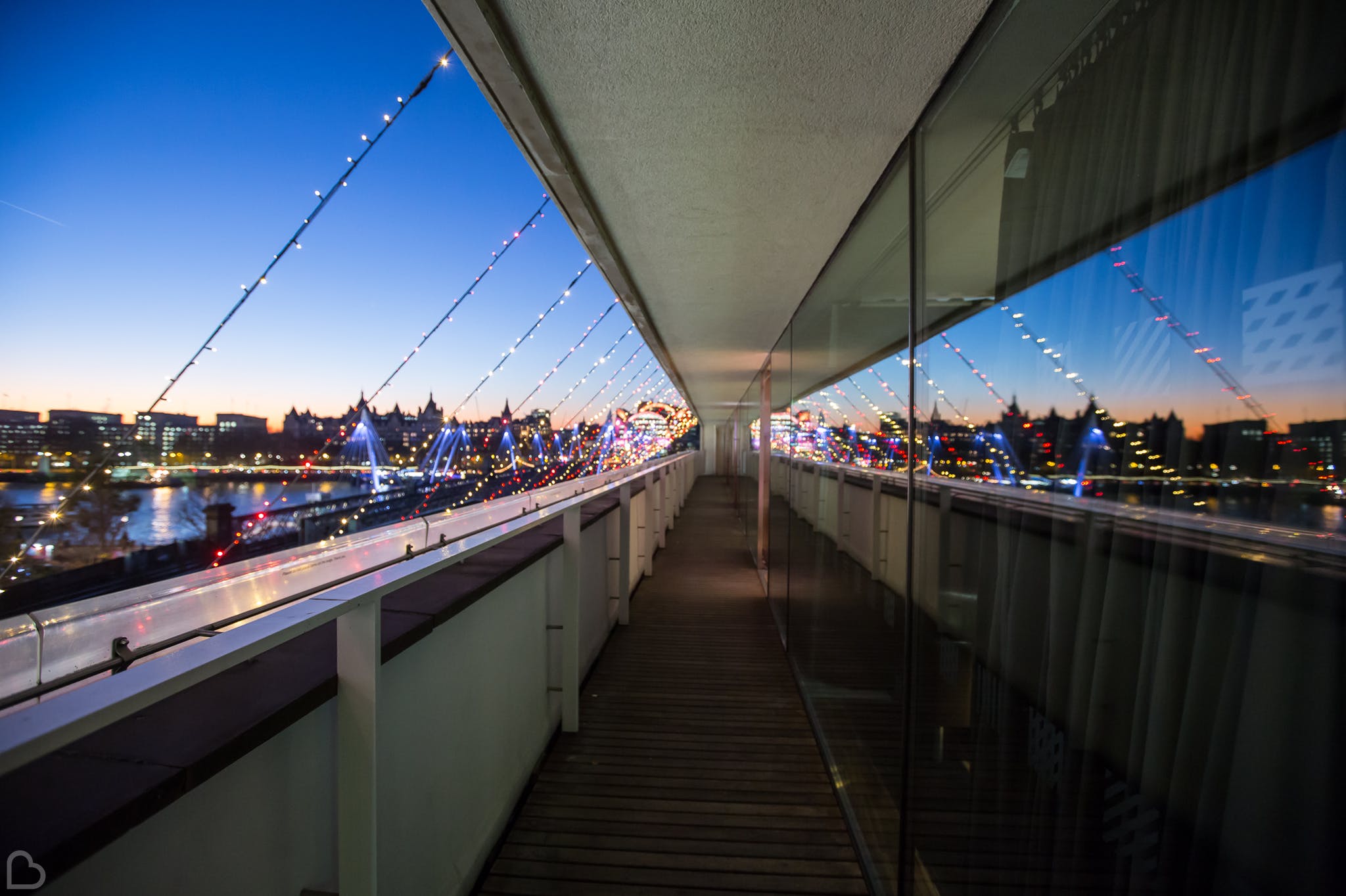 Southbank centre illuminated with fairy lights at dawn.