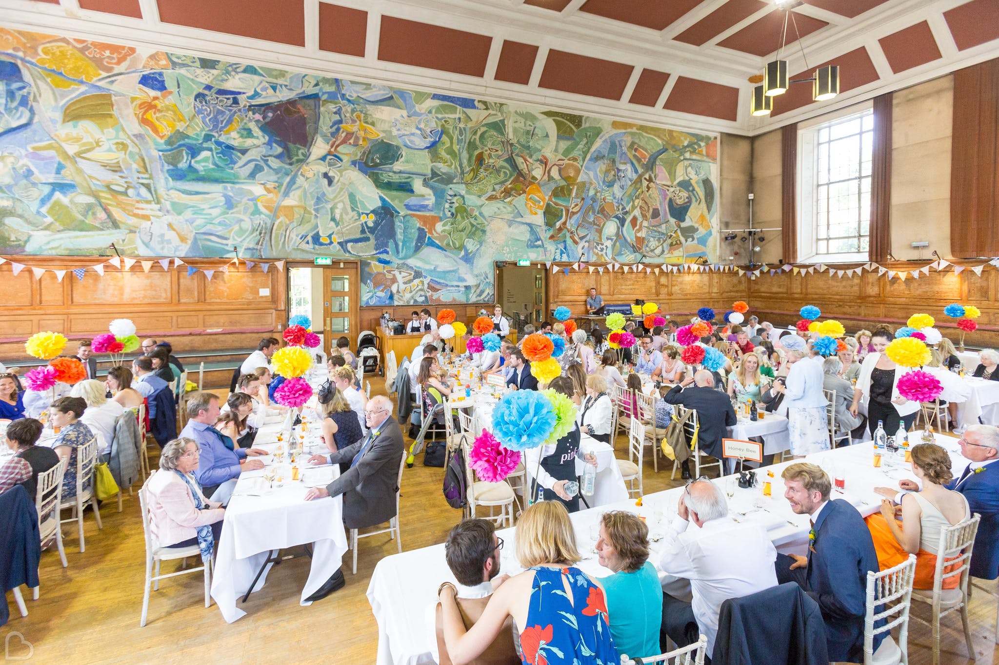 colourfully decorated wedding lunch setting at cecil sharp house.