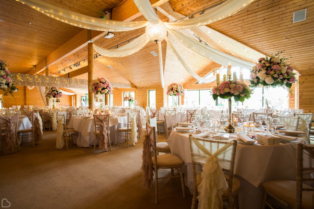 Beautiful large wedding lunch decorated with long sheets  and styal lodge.