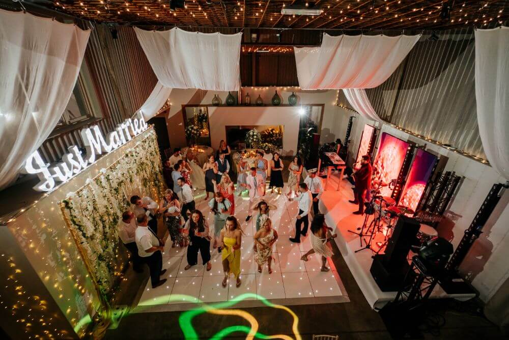 Party and dancing inside the barn. The ceiling is very high.