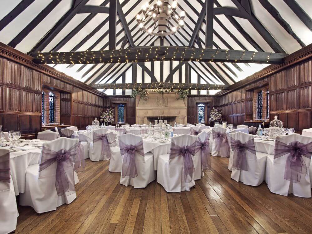 Inside the building, a reception room decorated in white and purple.