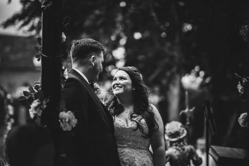 Black and White picture of the couple staring at each other.