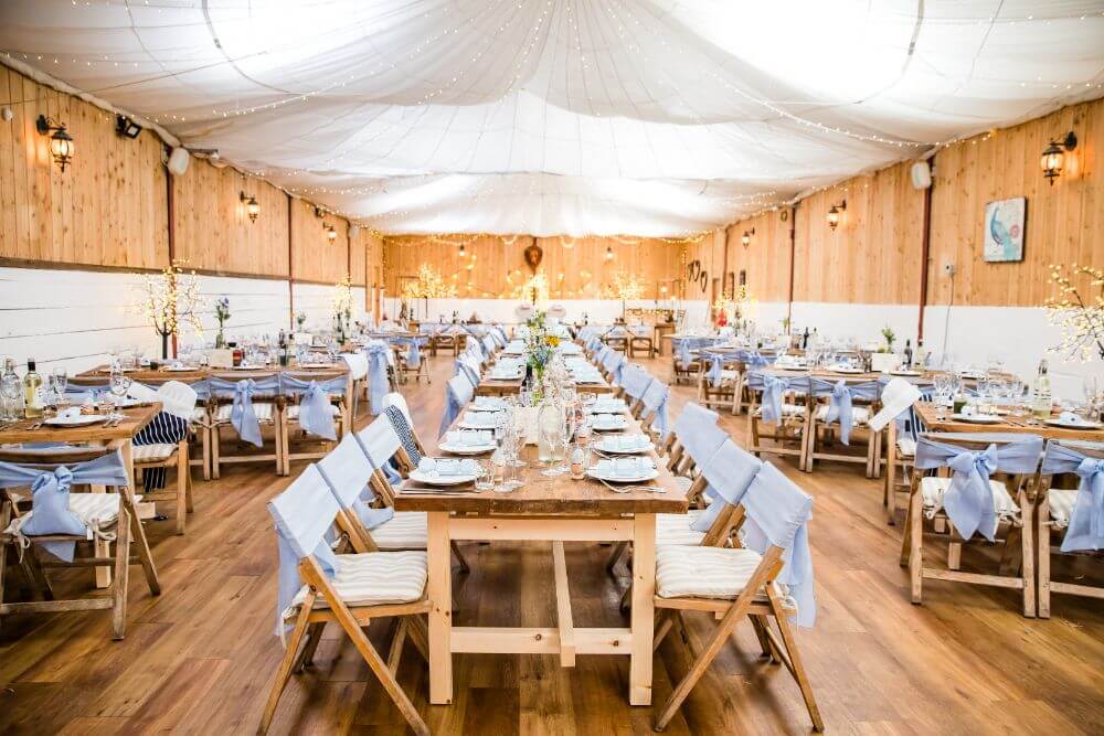 The dinner room made of wood decorated in blue.