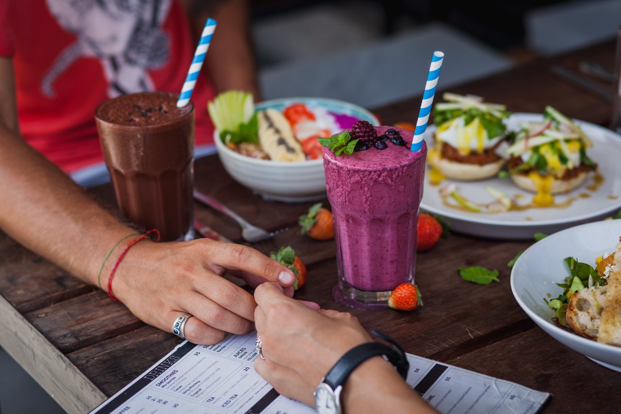 Couple at eating delicious lunch in cafe