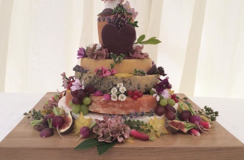 Vegetable and cheese tower served on table