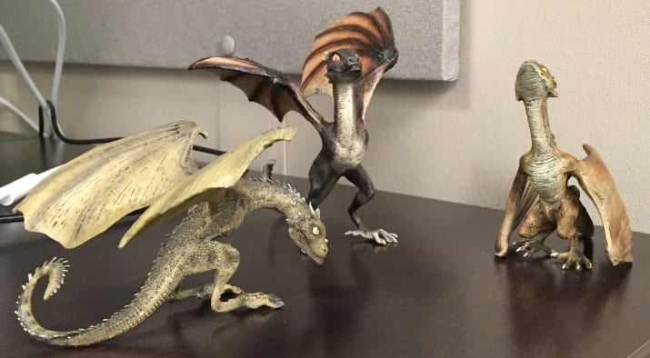 Resin figurines of Daenerys' dragons on my desk.