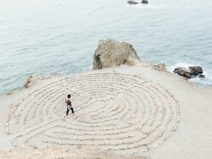 A path leading to a wall with the word Hello written on it.