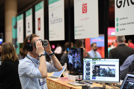 A young man using a virtual reality headset
