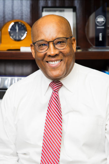 Photo of attorney Gregory Mitchell smiling directly at camera