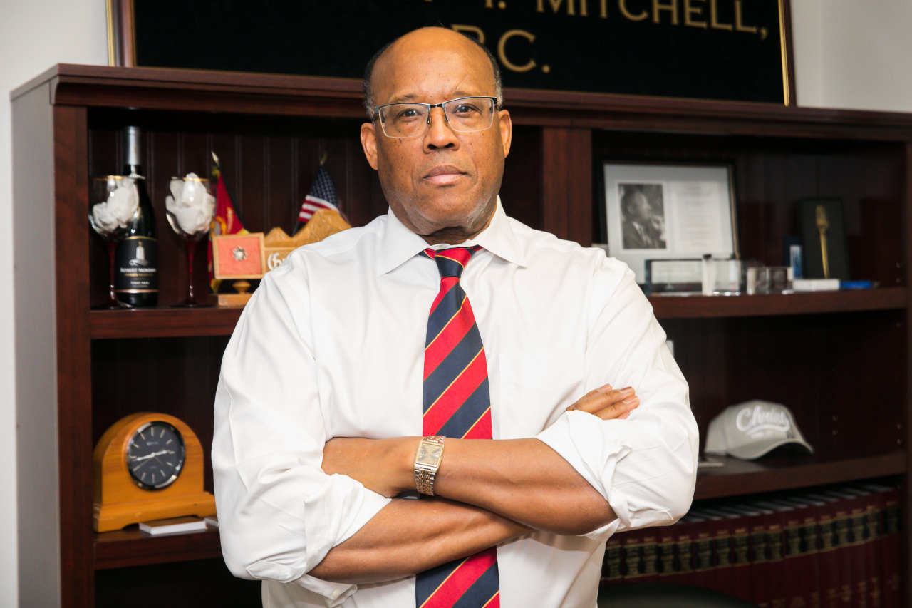 Attorney Gregory T. Mitchell with arms crossed