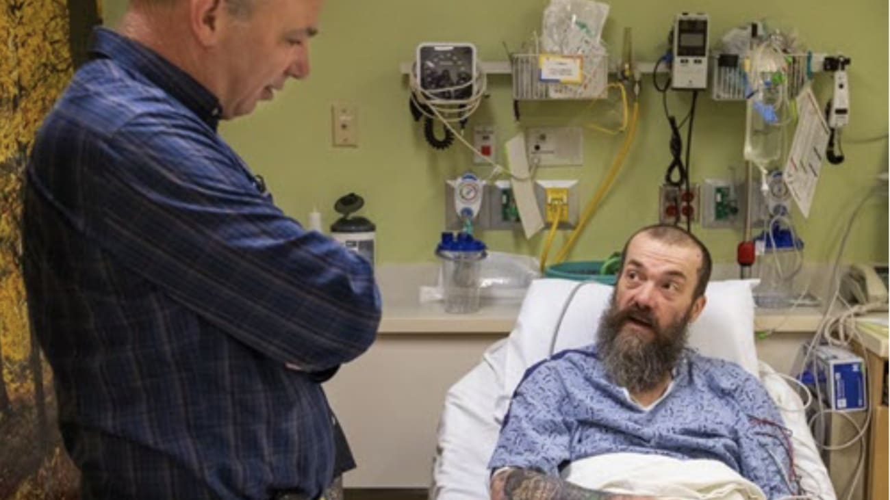 Jeffrey G. Ojemann, M.D., Division Chief of Neurosurgery at UW Medicine, left, talks with former tattoo artist Gary Williams before Williams underwent microsurgery to remove the part of his brain responsible for debilitating seizures. Williams agreed to donate the small bit of healthy tissue that had to be removed during the operation for scientific analysis.