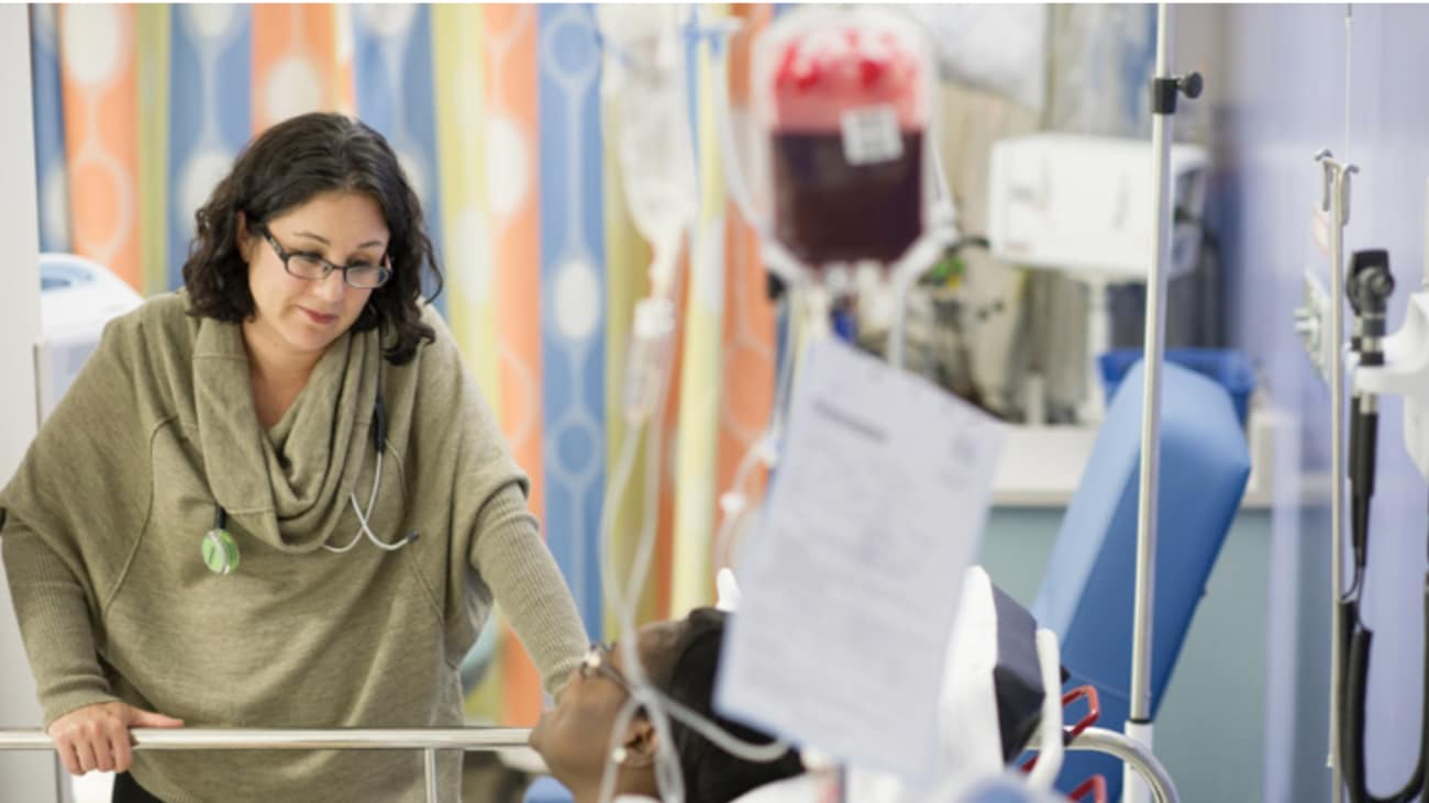 Julie Kanter, M.D., listens to a patient in MUSC’s nationally-ranked hospital.